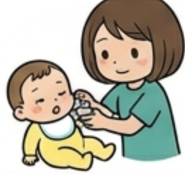 赤ちゃんに離乳食をあげる妻